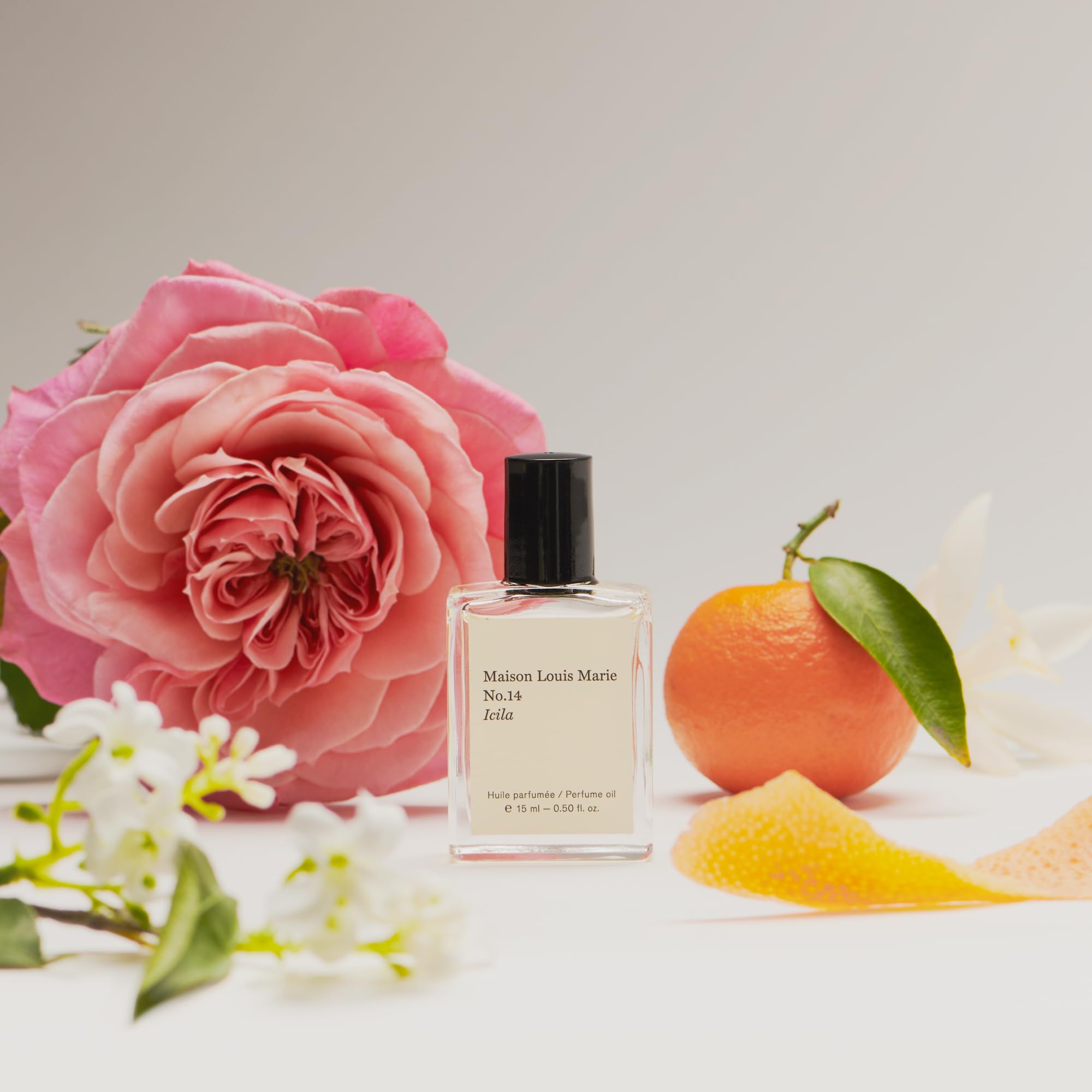 Maison Louis Marie Icila fragrance-note palette shows citrus, floral, and woody layers.