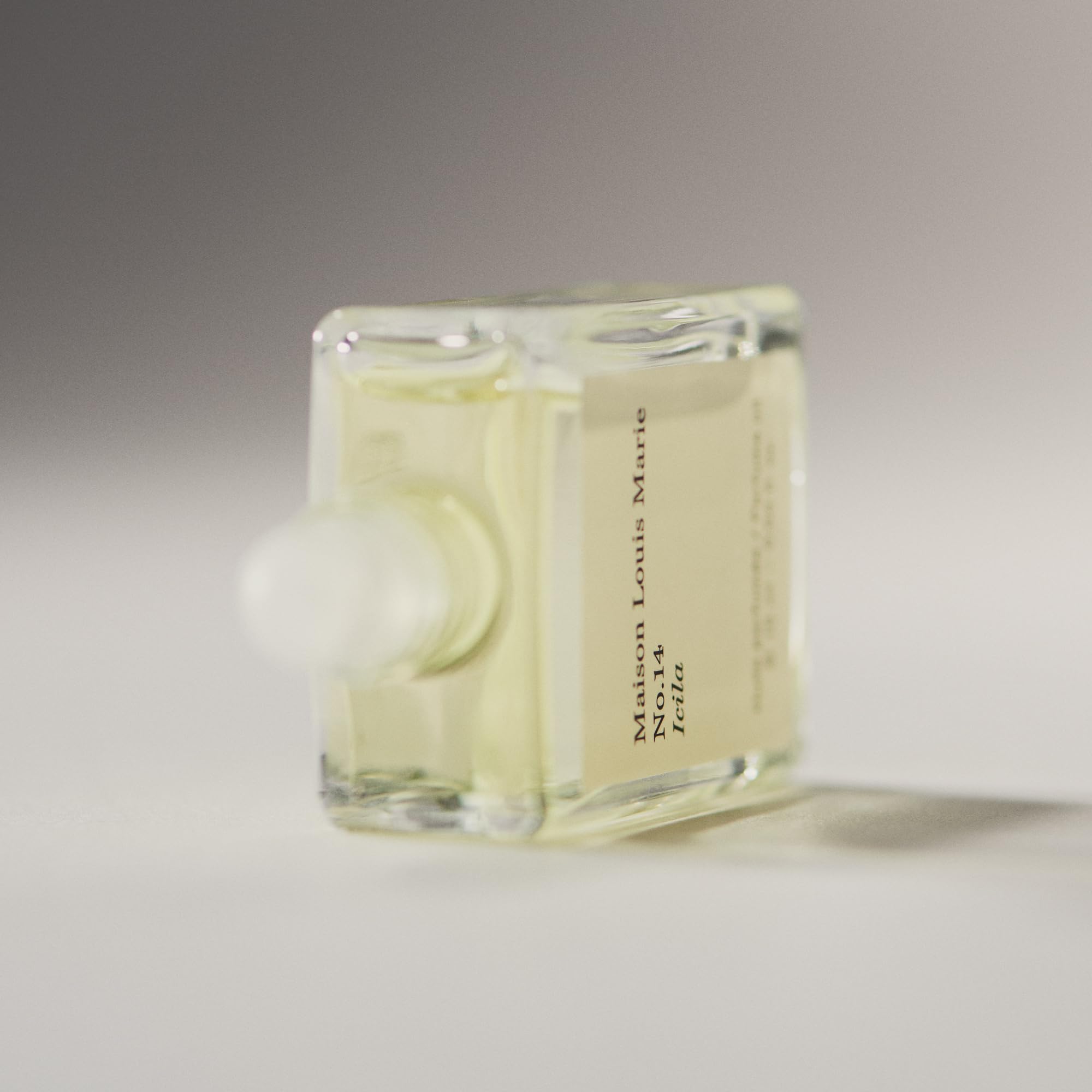 Maison Louis Marie Icila pulse-point use demonstrates neck, chest, and wrist application.