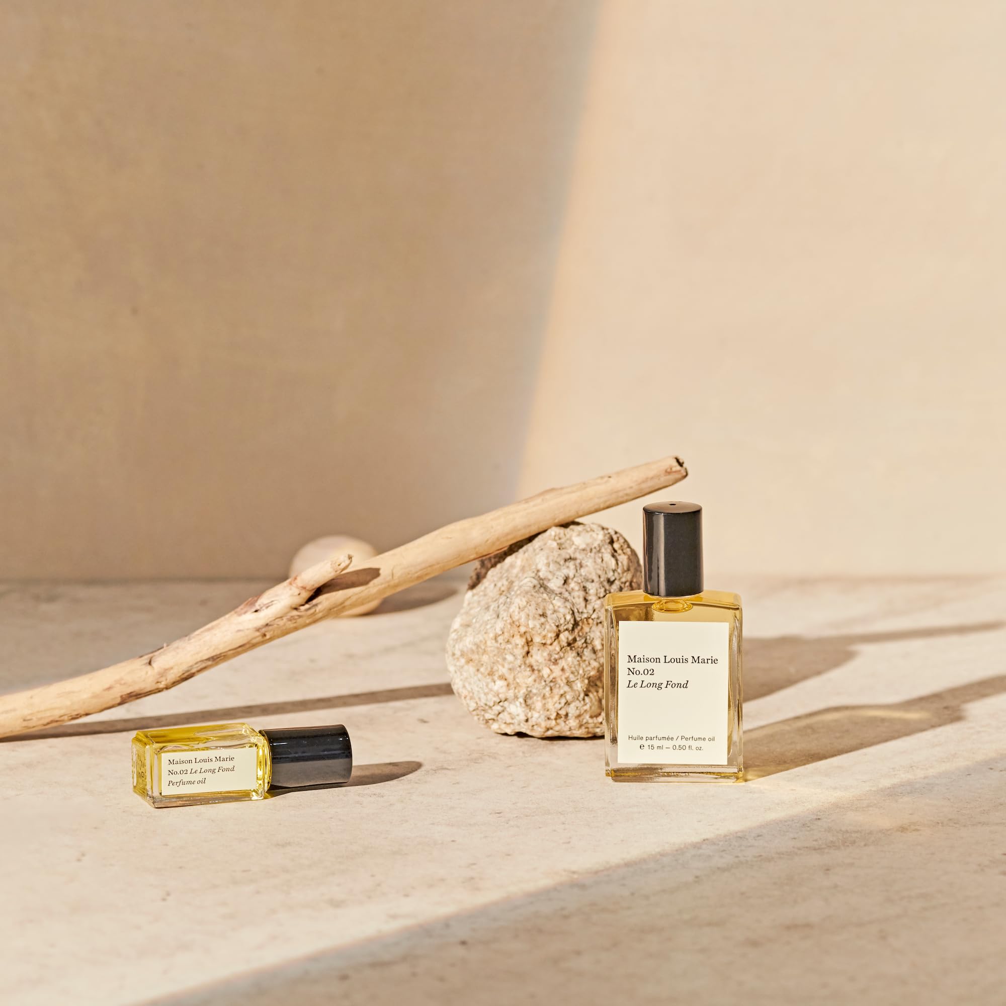 Hinoki cedarwood and patchouli notes visualized in Maison Louis Marie No.02 Le Long Fond.