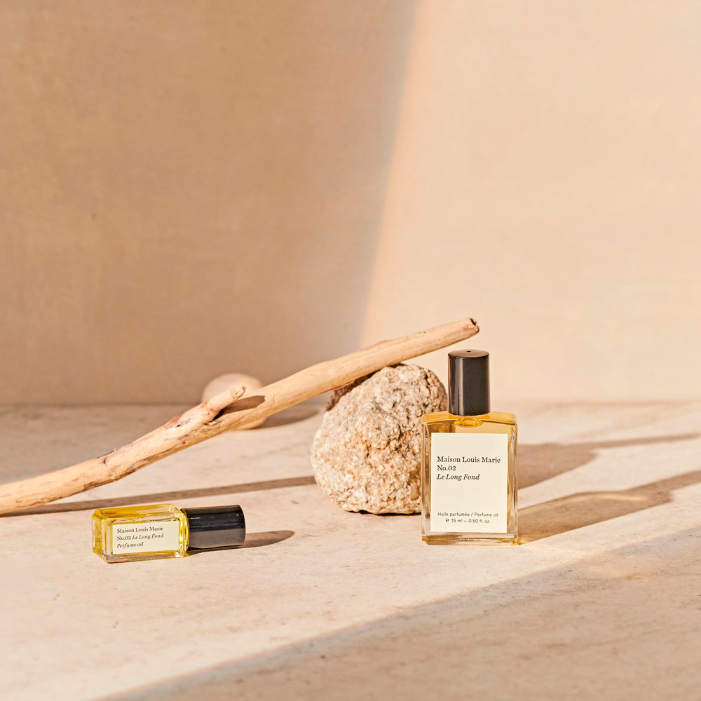 Hinoki cedarwood and patchouli notes visualized in Maison Louis Marie No.02 Le Long Fond.