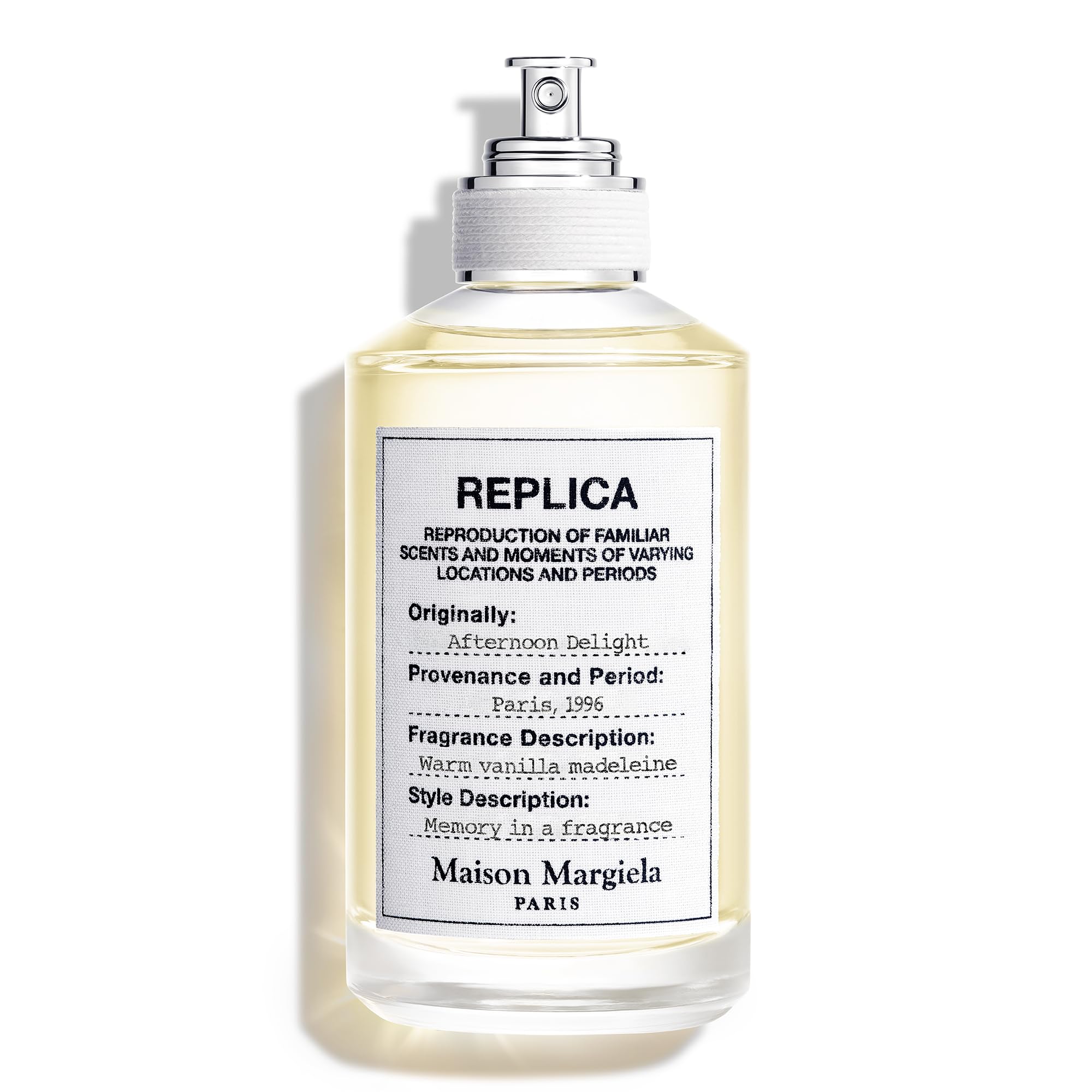 Maison Margiela Replica Afternoon Delight bottle highlights a warm gourmand fragrance for cozy evenings.