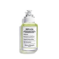 Maison Margiela Replica From the Garden bottle in sunlight evokes fresh daytime wear.