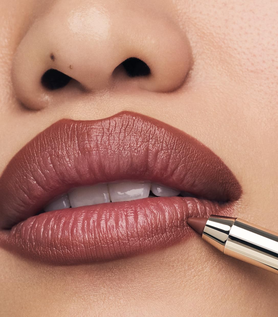 Make Beauty Lip Continuum Euphoric swatch reveals deep rosy nude shade.