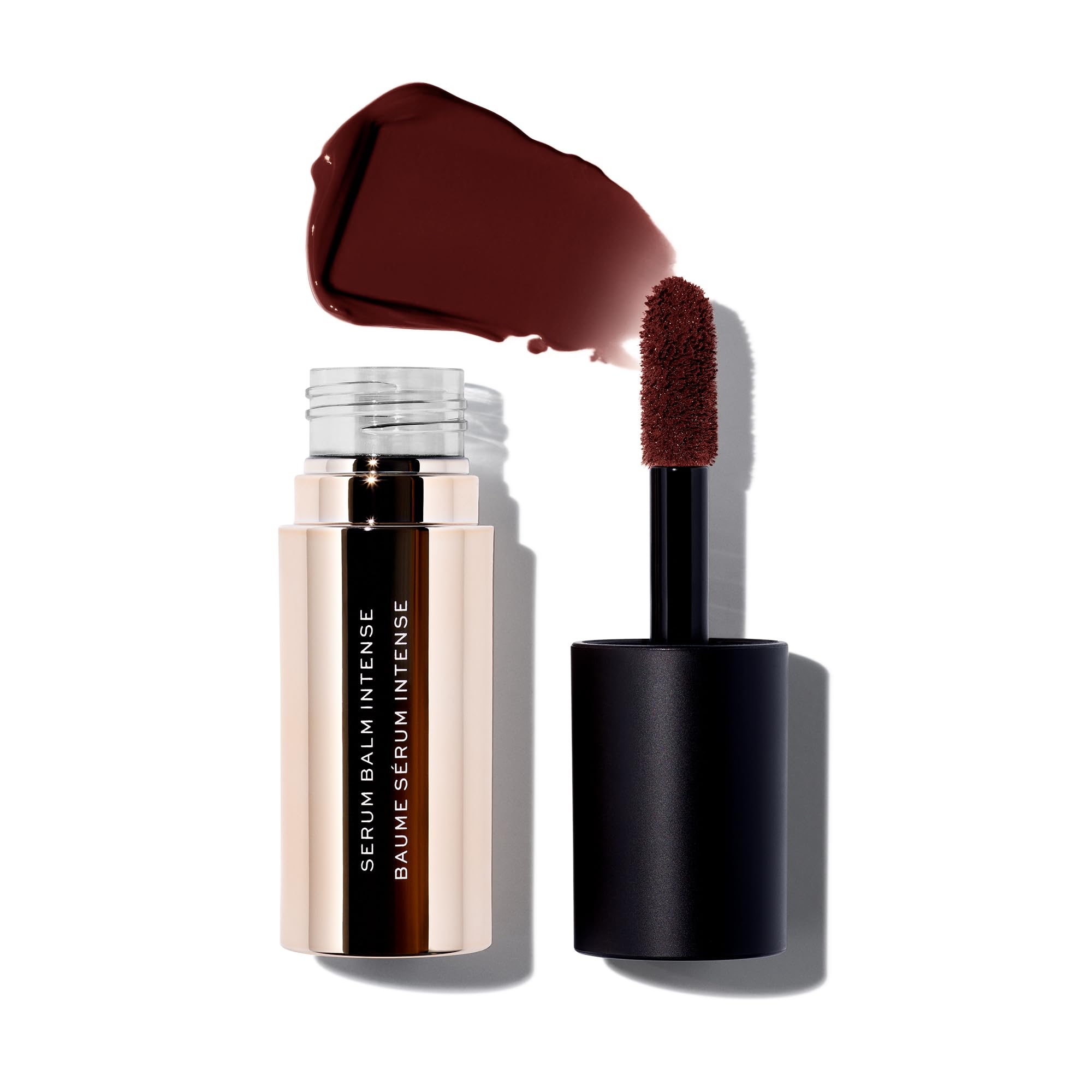 MAKE Beauty Serum Balm Intense bottle shows hydrating gloss for a glossy pout.