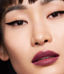 MAKE Beauty Serum Balm Intense Lilac Layer+ on lips with lasting shine