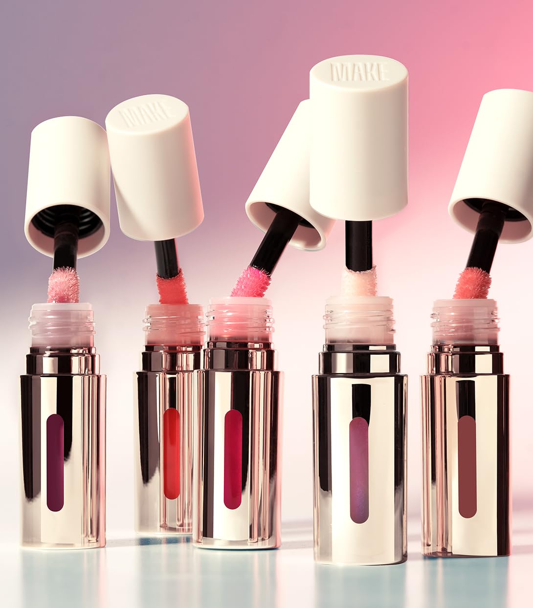 MAKE Lip oil vegan formula shown on lips highlighting hydration.