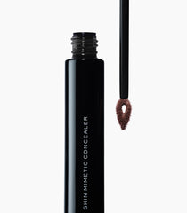 MAKE Beauty Skin Mimetic Concealer deep cool shade bottle highlights rich tones.