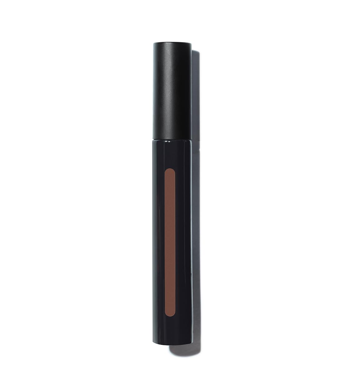 Texture close-up reveals creamy, lightweight concealer blending smoothly.