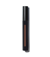Texture close-up reveals creamy, lightweight concealer blending smoothly.