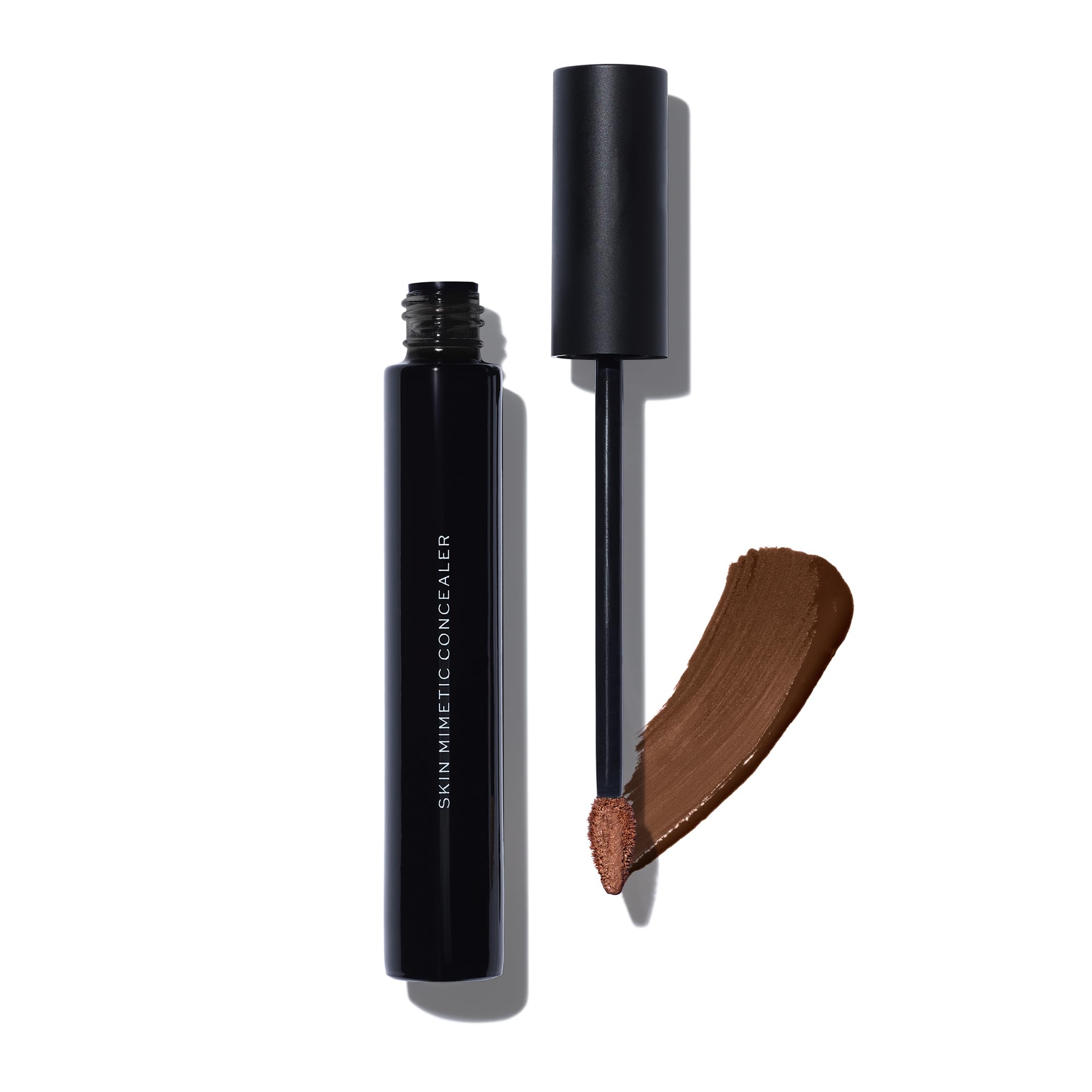 MAKE Beauty Skin Mimetic Concealer tube with natural, buildable coverage.