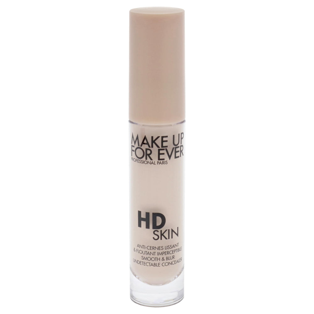 Make Up For Ever HD Skin Concealer being dabbed under the eye for brightening.