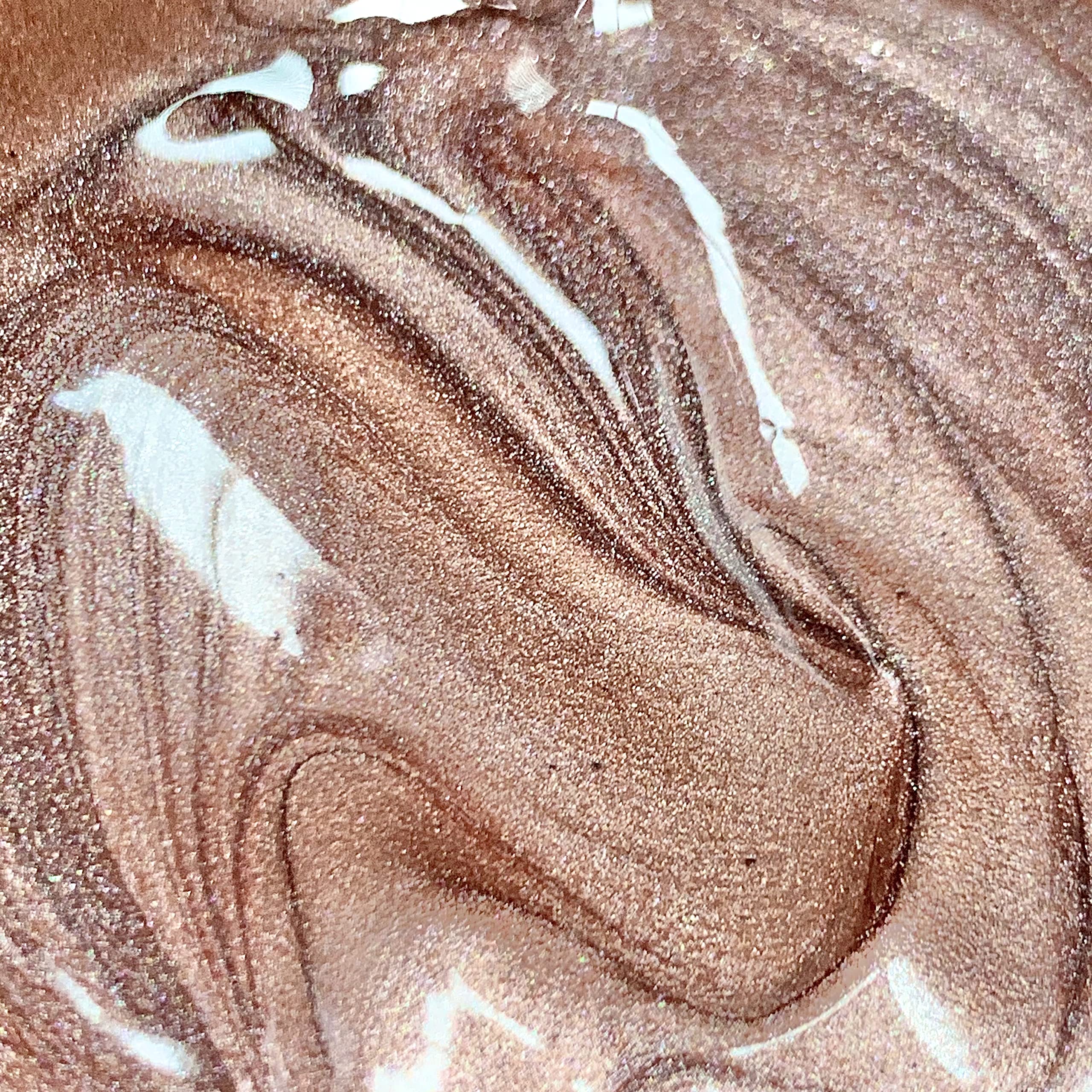 Molten Body Glow Rose Gold being mixed with foundation for tailored luminosity