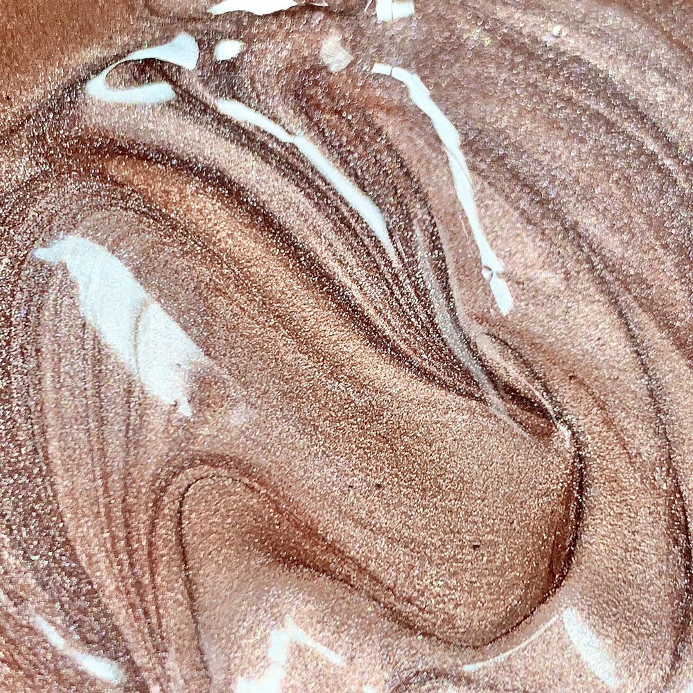 Molten Body Glow Rose Gold being mixed with foundation for tailored luminosity