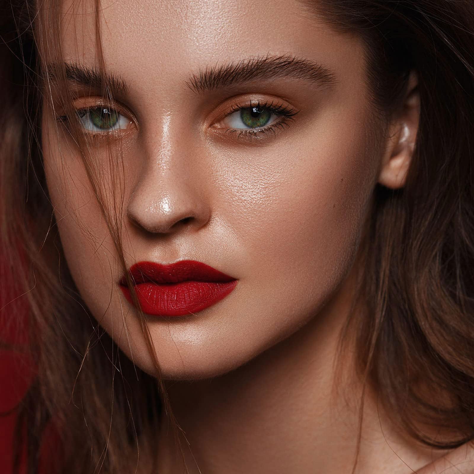 Close-up of MAKI YIKA lipstick being applied smoothly.
