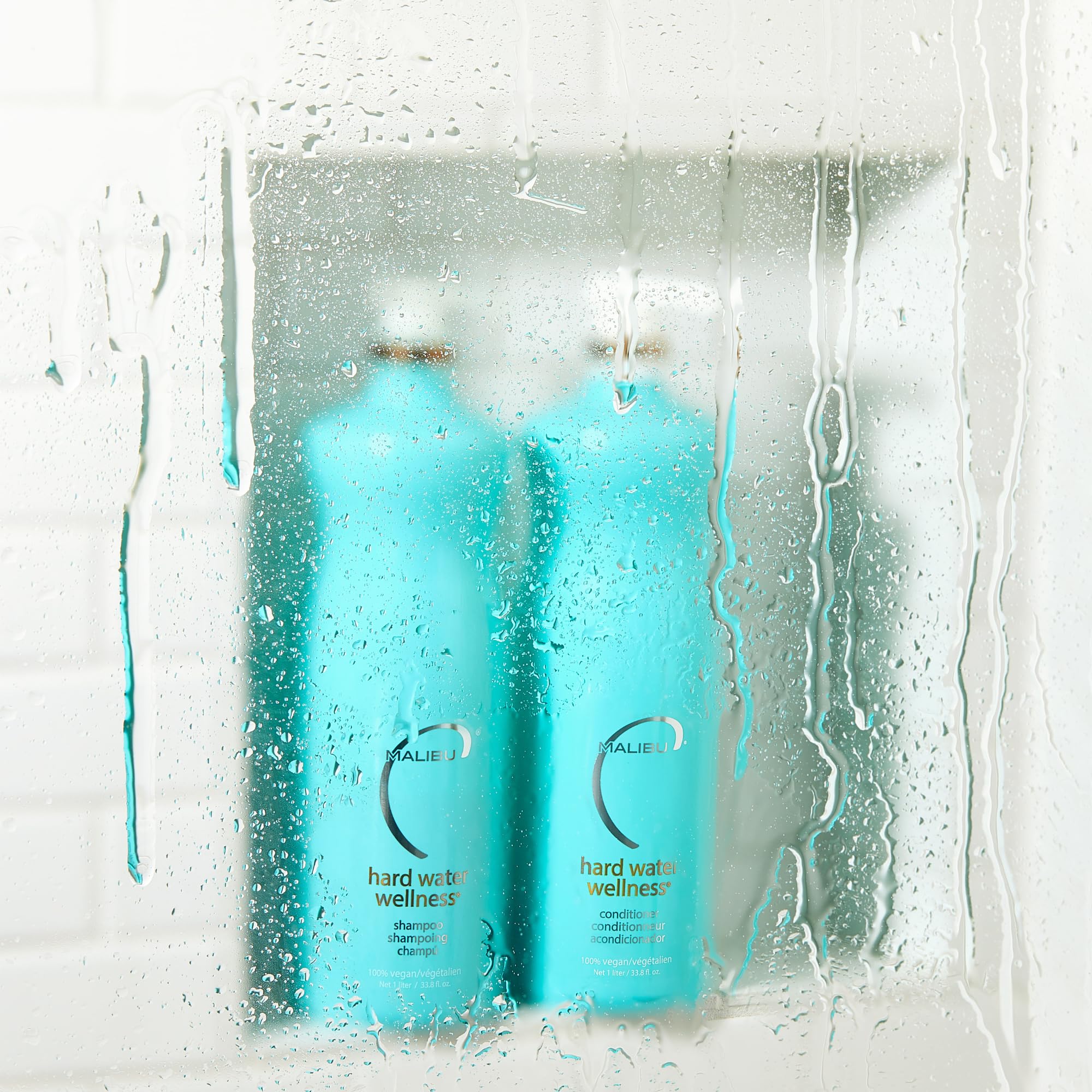 Malibu C Hard Water Conditioner bottle highlighting detangling hydration and mineral defense.