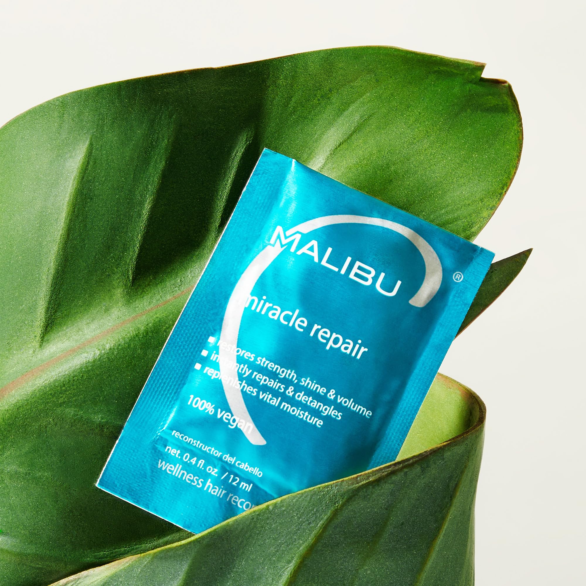 Malibu C Miracle Repair application on hair for deep conditioning