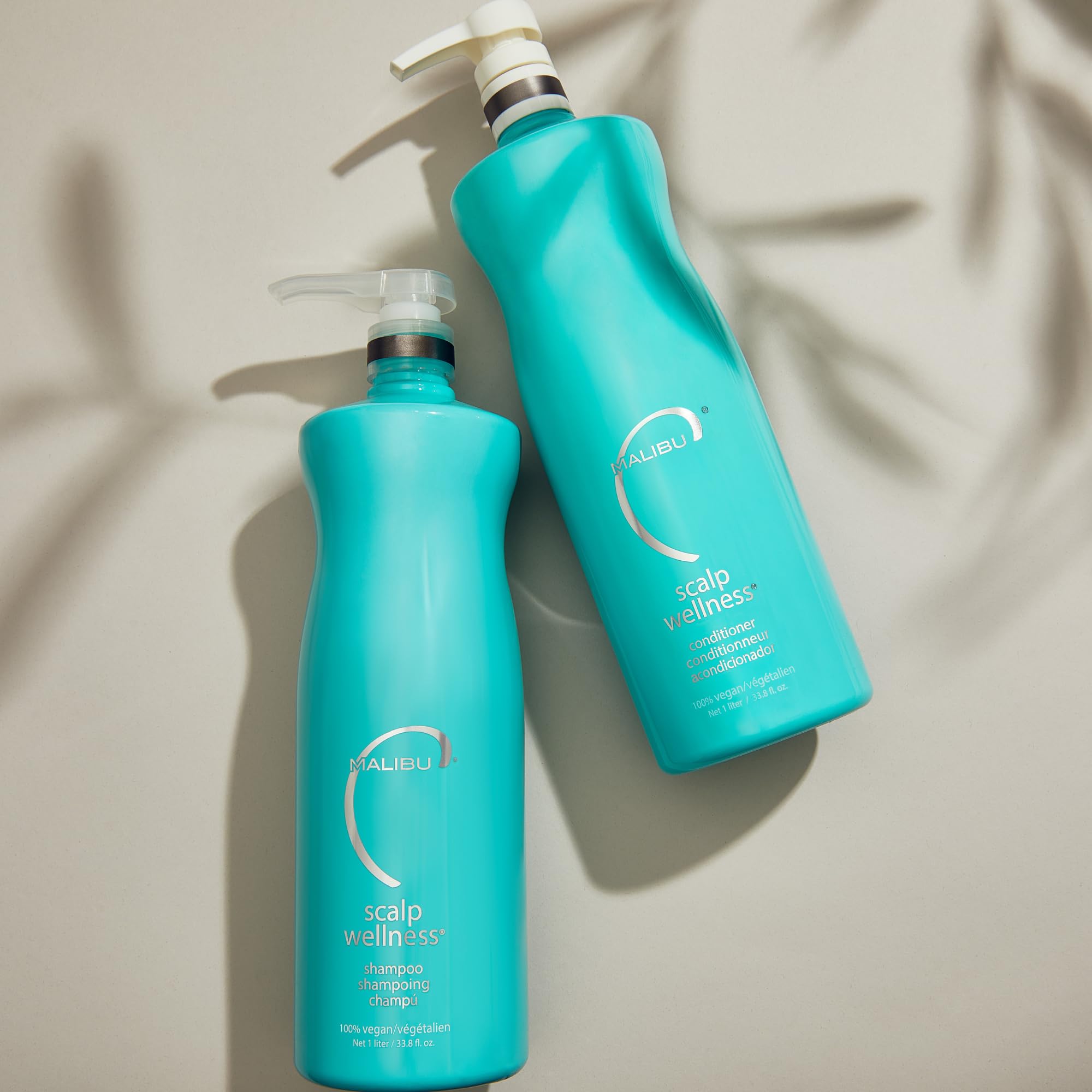 Malibu C Scalp Wellness Conditioner being applied from mid-lengths to ends.