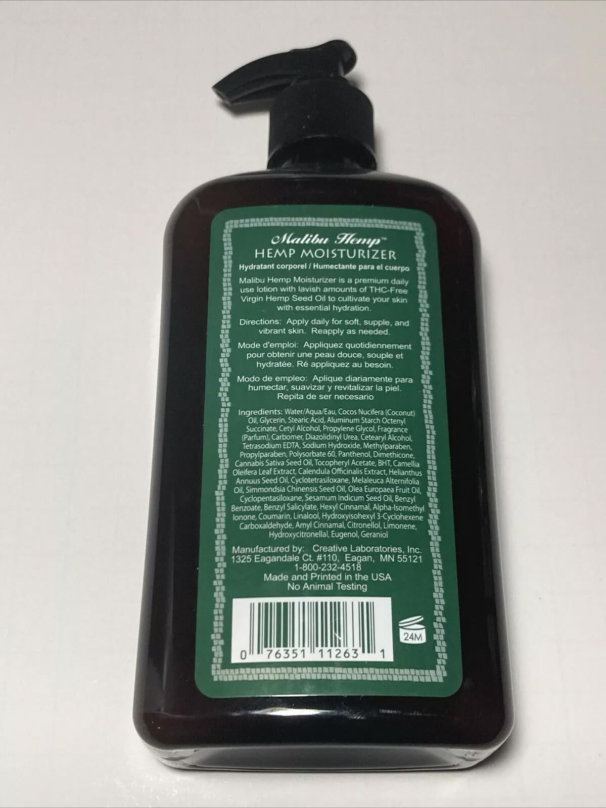 Applying Malibu Tan Body Lotion on arm shows quick absorption.