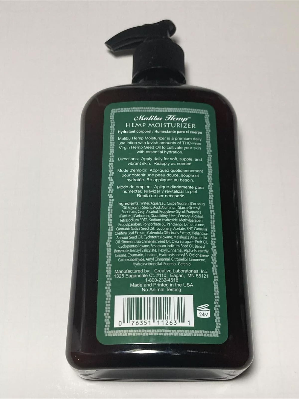 Applying Malibu Tan Body Lotion on arm shows quick absorption.