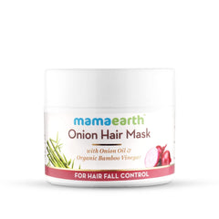Mamaearth Onion Oil Hair Mask bottle close-up highlighting nourishing formula for scalp health.