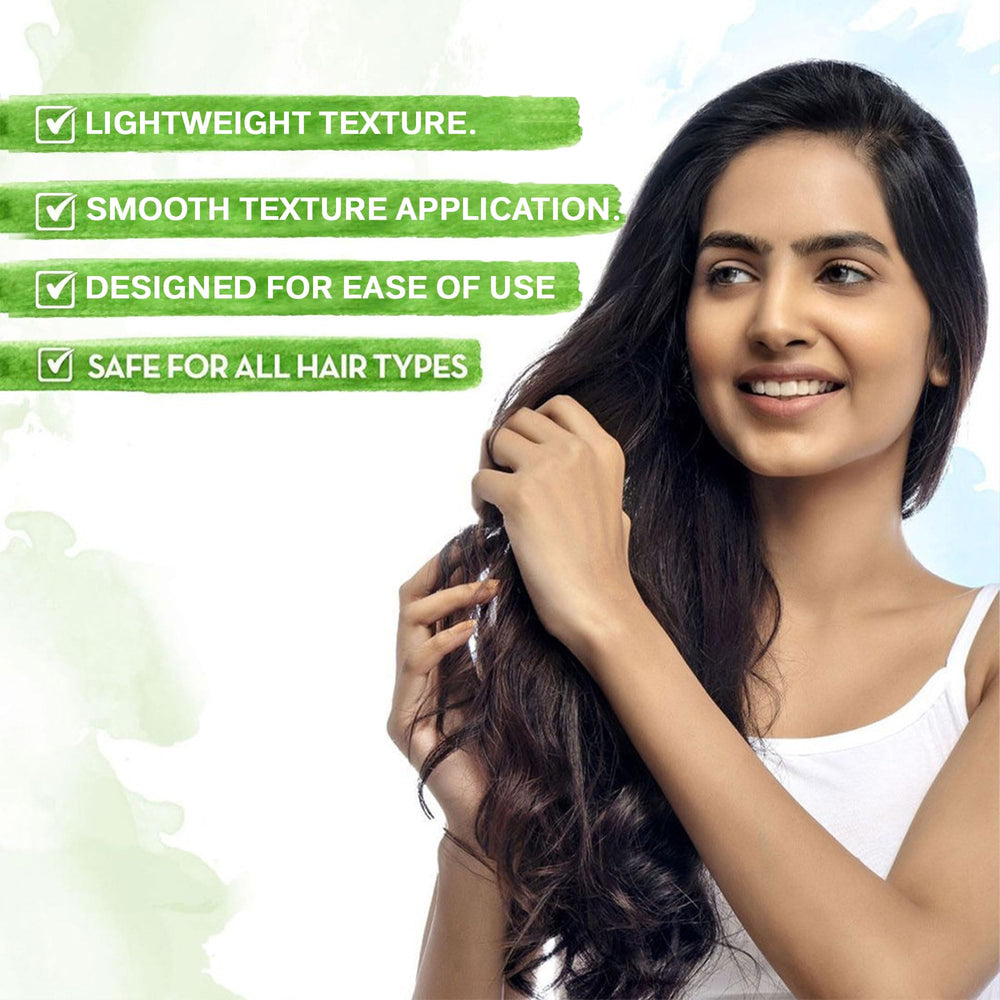 Mamearth Onion Hair Oil on hair strands for smooth, healthy-looking results.