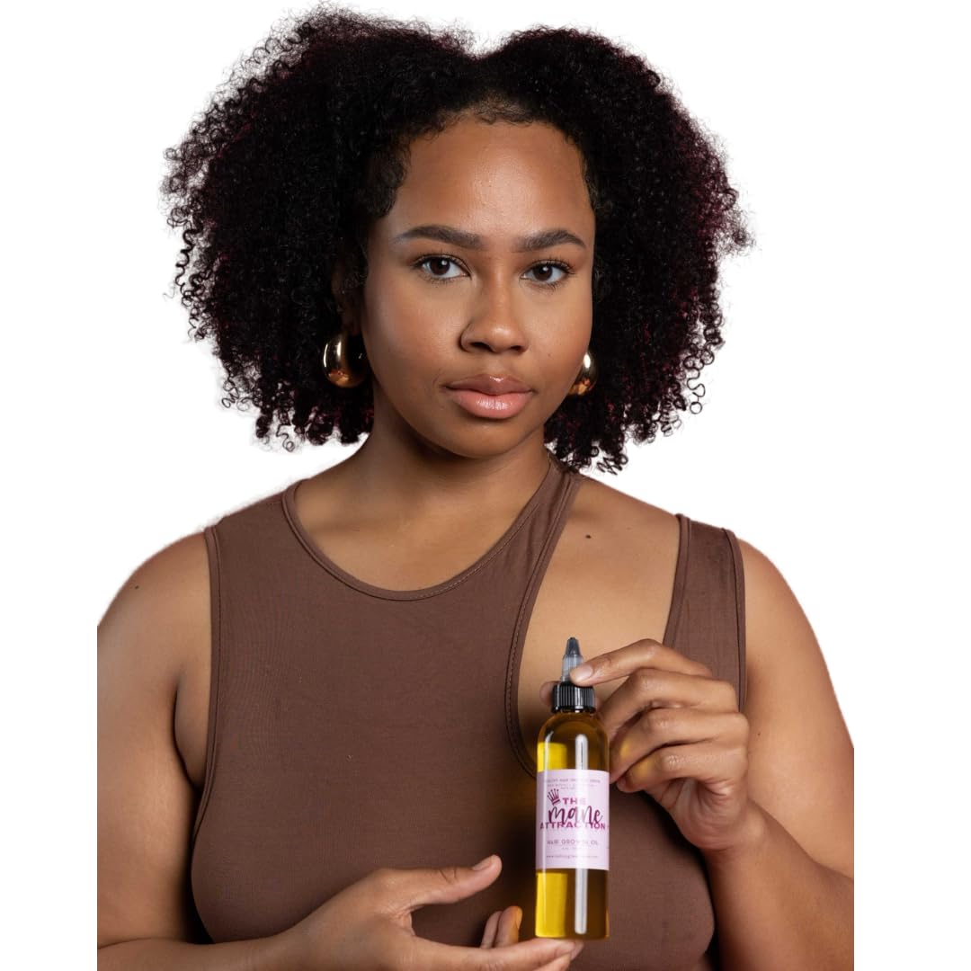 The Mane Attraction bottle on hair reveals a silky shine and moisture lock.