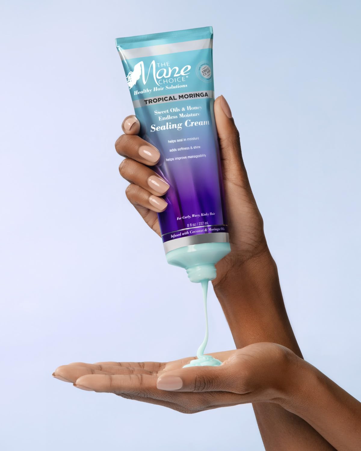 Texture closeup reveals nourishing biotin and vitamin E in The Mane Choice formula.