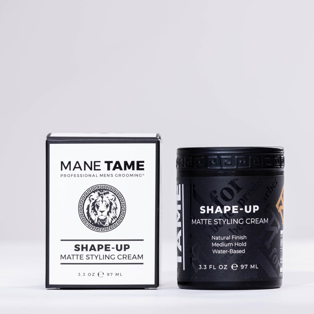 Mane Tame Shape-Up Matte Cream being applied by hand for smooth distribution.