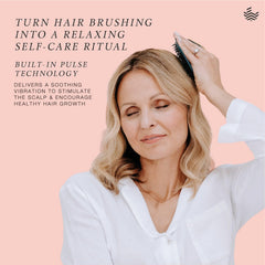 MANTA Pulse exfoliating scalp brush close-up ready to exfoliate and cleanse.