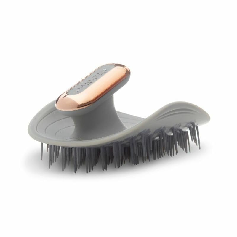 MANTA Pulse waterproof scalp massager shown under shower water for durable wet use.