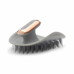 MANTA Pulse waterproof scalp massager shown under shower water for durable wet use.