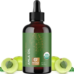 Maple Holistics Amla Oil bottle pour shows nourishing hair treatment.