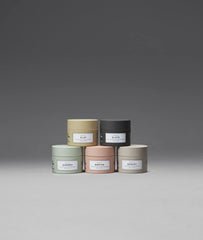 Applying Maria Nila Minerals Clay to dry hair for controlled styling.