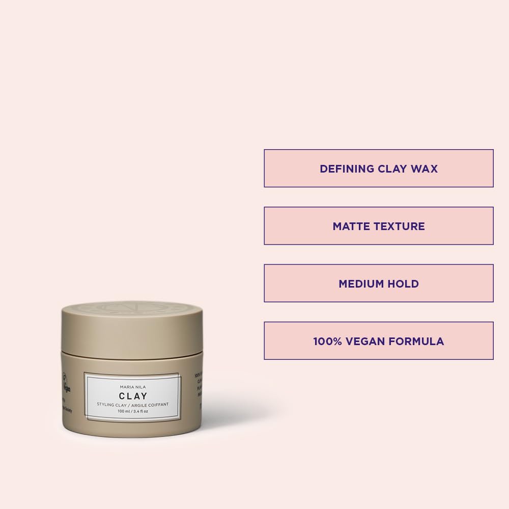 Hands warming Maria Nila Minerals Clay to activate and spread evenly.