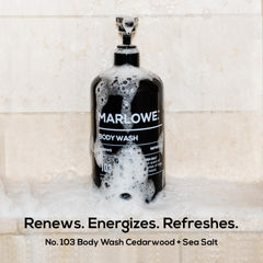 Close-up of MARLOWE No. 103 label highlighting cedarwood scent notes