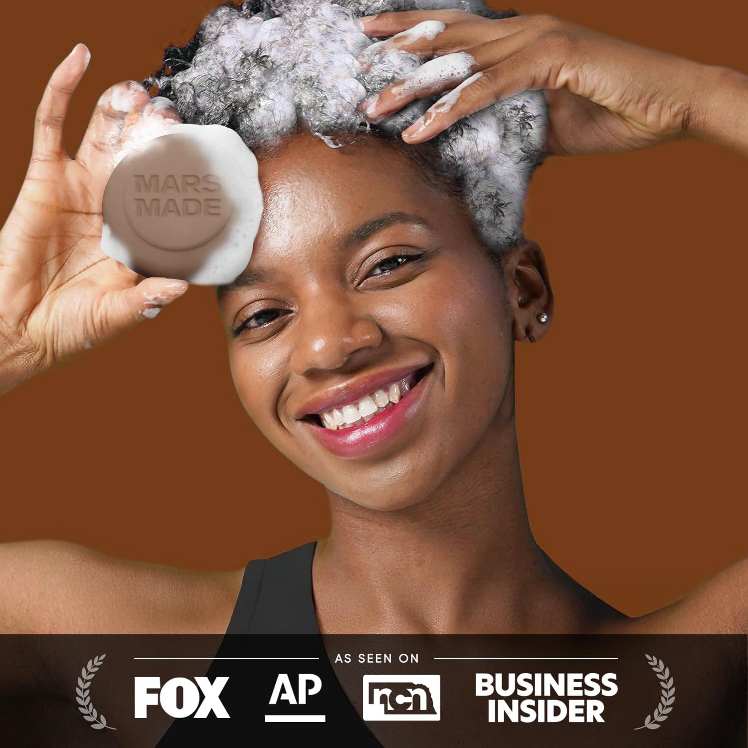 Mars Made Jojoba Oil Shampoo Bar 2.0 ingredients close-up: olive oil, coconut acid, cocoa.