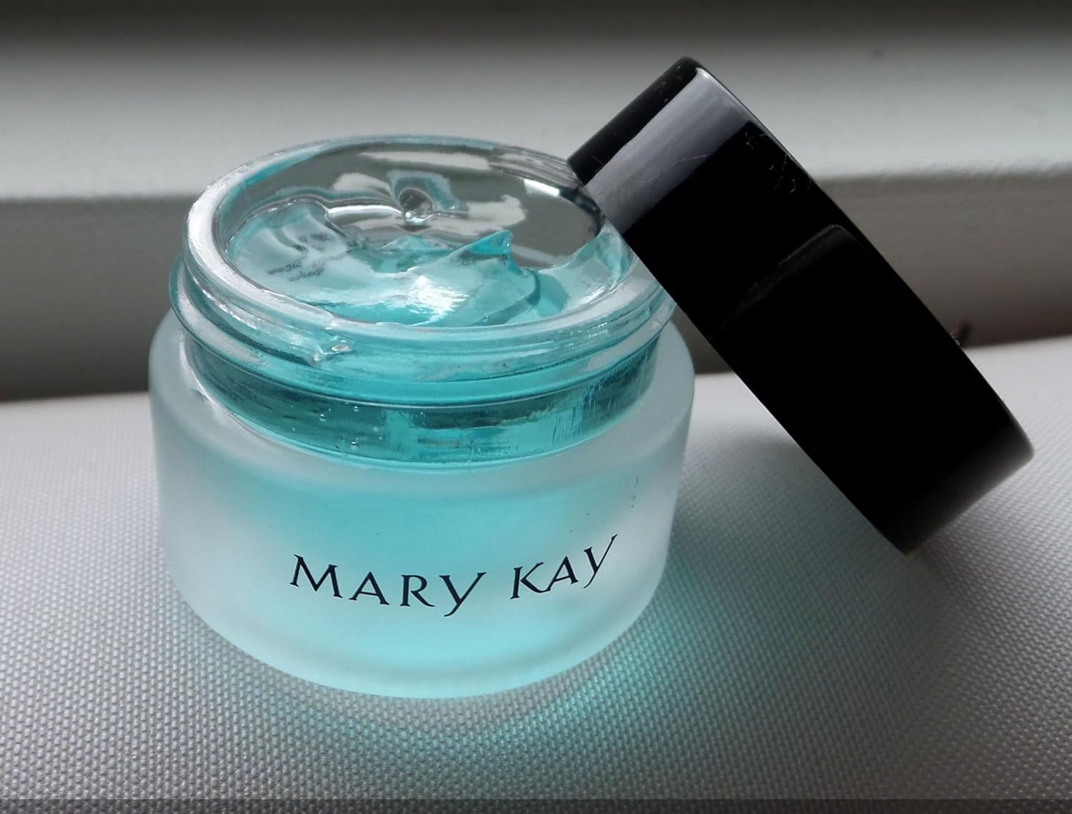 Mary Kay Indulge Soothing Eye Gel jar closeup showing calming fragrance-free formula.