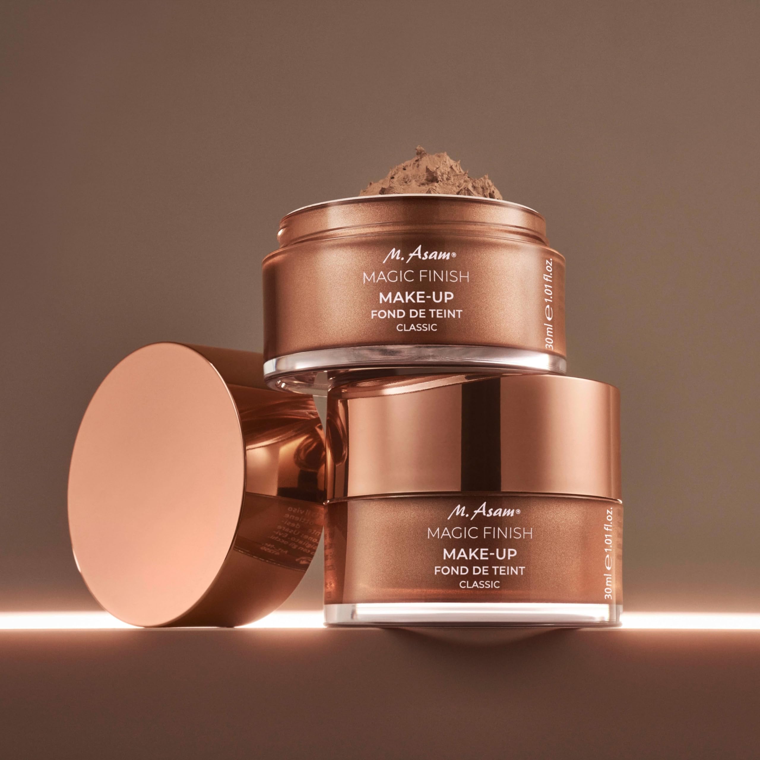 Applying M. Asam Magic Finish Mousse with fingers for quick coverage