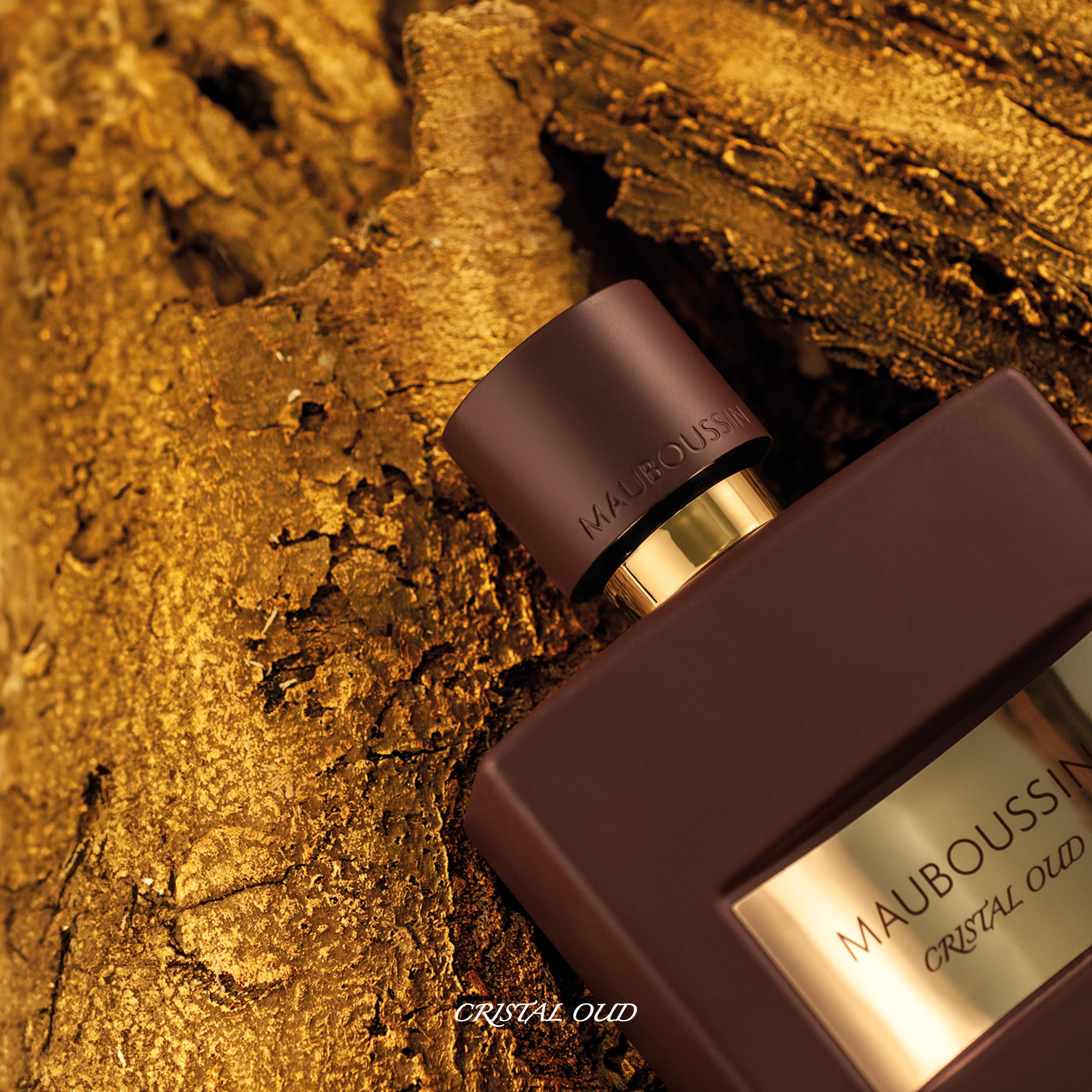 Mauboussin Pour Lui Crystal Oud bottle with jewel facets conveys timeless chic.