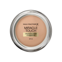 Max Factor Miracle Touch foundation bottle close-up, shade Golden 075, hydrates for a smooth base.