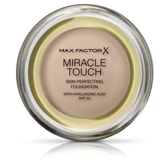 Max Factor Miracle Touch Foundation Creamy Ivory 040 bottle pour for even coverage