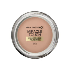 Max Factor Miracle Touch foundation bottle with pump for easy daily application.