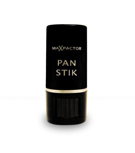 Applying Pan Stik on the cheek to blend and even tone.
