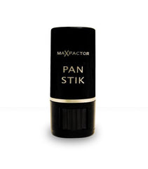 Applying Pan Stik on the cheek to blend and even tone.