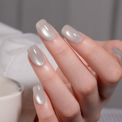MAYCHAO Silk Silver Cat Eye gel polish undergoing LED cure for quick setting.