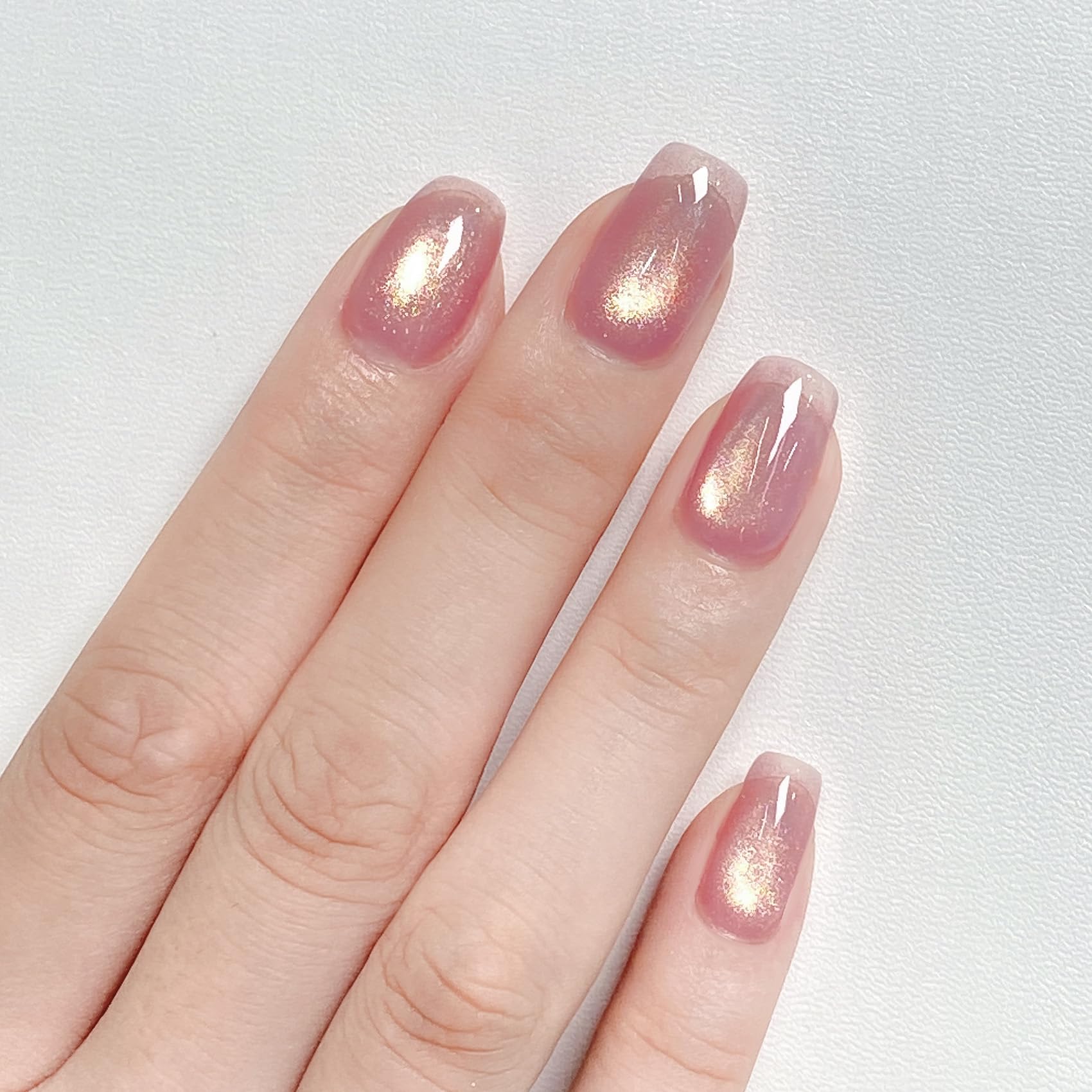 MAYCHAO Golden Amethyst gel polish bottle under LED curing light
