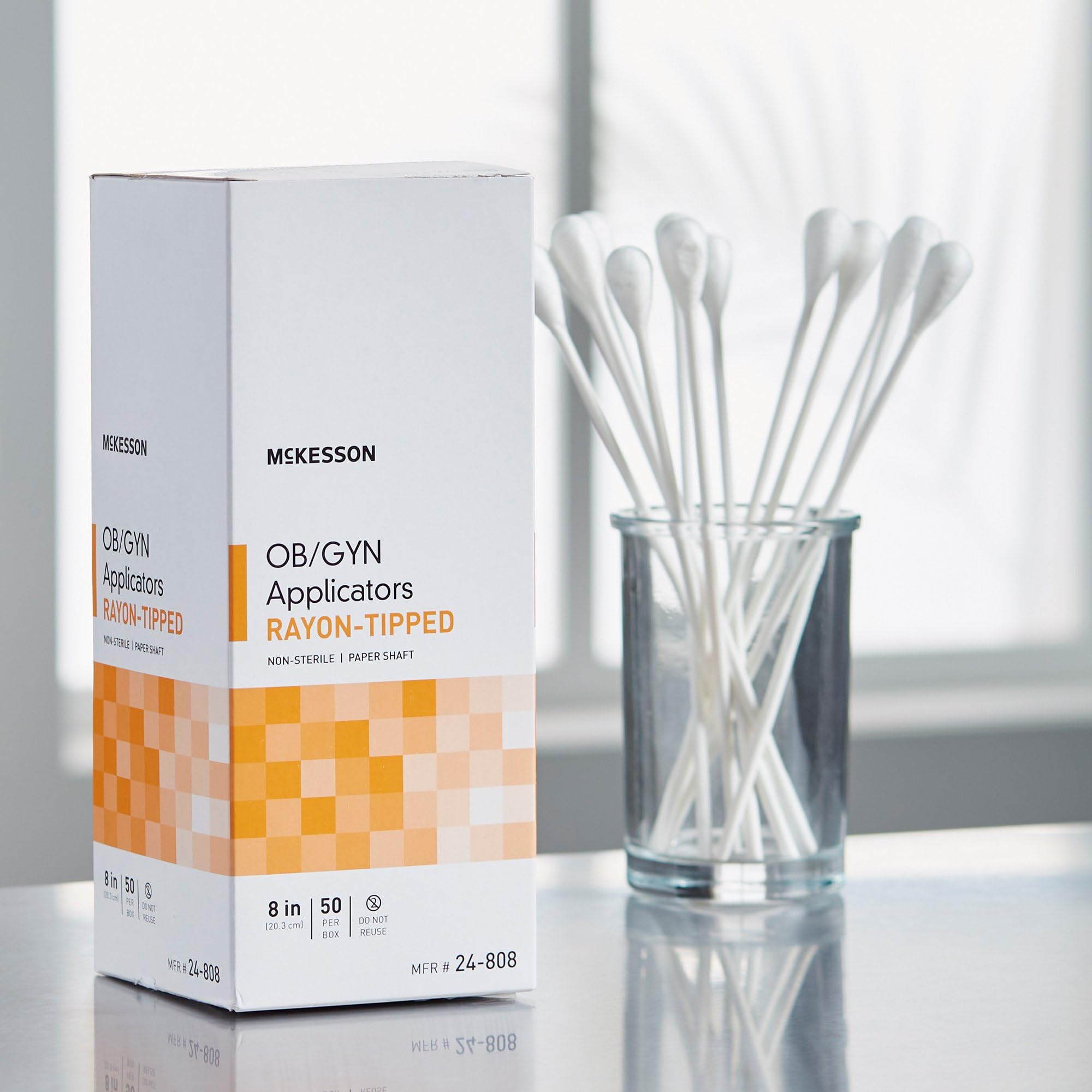 Full 8-inch length of McKesson OB/GYN rayon-tipped applicator for reach.