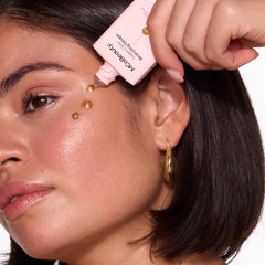 Swatches of MCoBeauty Bronzing Drops demonstrating warm bronze payoff
