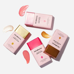 Blush drops mixed into moisturizer for natural radiance