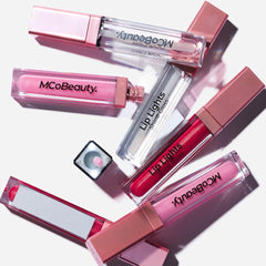 MCoBeauty Lip Lights Shine Gloss application close-up shows silky, non-sticky glow.